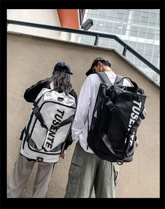 Outdoor view of large capacity waterproof oxford travel bags in black and white colors