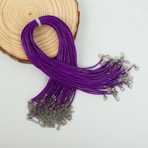 Close-up of purple waxed cord necklace with silver lobster clasp and extension chain
