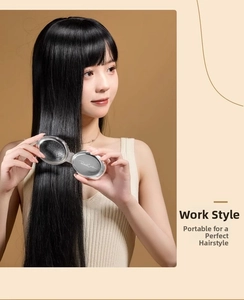 Foldable pocket hairbrush with built-in mirror shown in use by a woman for quick styling