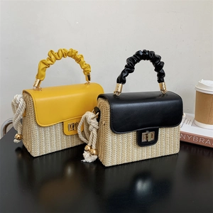 Handcrafted straw box handbags with pleated handles and metallic twist locks in yellow and black
