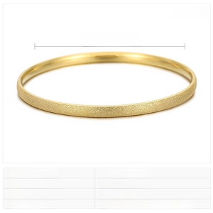 Detail view of 60mm diameter gold stainless steel bangle with a matte frosted finish