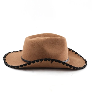 Detail of brown wool fedora hat with black wavy stitched edge and slim leather band
