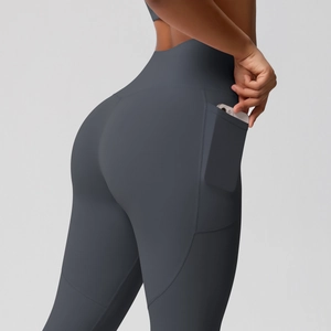 Detail of high waisted dark grey yoga leggings with functional side phone pocket