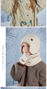 Detailed knit texture of cream winter hat, scarf and gloves set for kids in snow scene