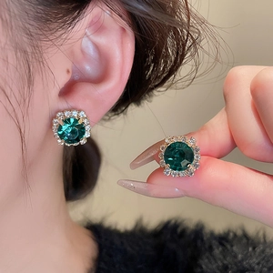 French vintage luxury jewelry set featuring green square gemstone earrings with crystals