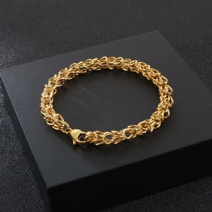 Golden stainless steel Byzantine chain necklace with lobster clasp on black background