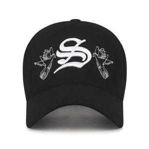 Black cotton baseball cap with embroidered S letter and bird motifs on white background