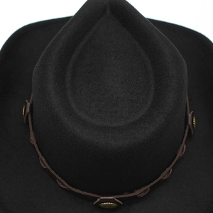 Detailed overhead view of black felt cowboy hat featuring embossed metal studs on leather band