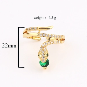 Detail view of gold snake ring with green zircon showing 22mm height and 4.5g weight