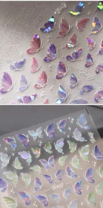 Macro view of holographic butterfly nail stickers with 3D embossed texture and laser finish