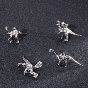 Retro stainless steel dinosaur pendant set for men featuring four distinct prehistoric designs