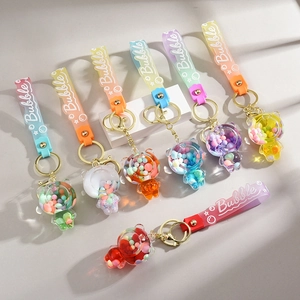 7Pcs Liquid bear keychains with gradient silicone straps and colorful inner beads