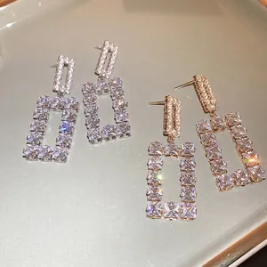 Luxe hollow rectangular geometric earrings with cubic zirconia in silver and gold finish