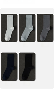 Close-up of five pairs of men's silk business socks in classic assorted neutral colors