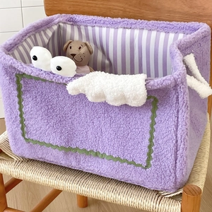 Detailed plush monster storage basket with purple faux fur and striped lining