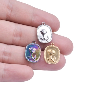 Vintage rose embossed oval pendants in silver, gold, and rainbow stainless steel