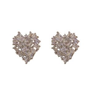 Elegant silver heart studs with faceted zircon stones on a clean white background