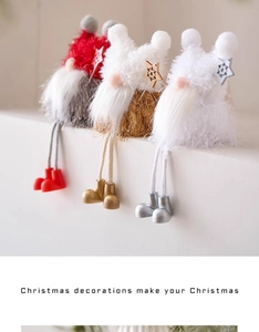 Close-up of three plush long-legged Christmas gnomes in red, gold, and silver tones