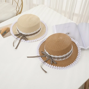 Women's straw sun hats with lace trim and bow ribbon in beige and brown colors