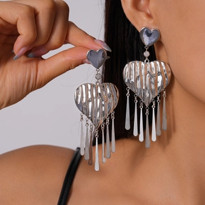 Silver metallic heart earrings with wave texture and long flat fringe tassels