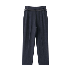 Detail of high waisted straight leg trousers in dark blue grey with a slim black belt