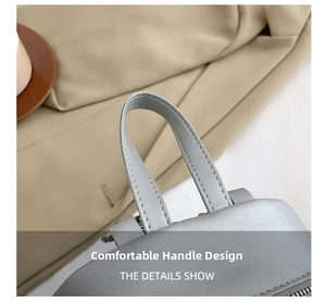 Detailed macro view of light grey synthetic leather handle with fine lychee texture