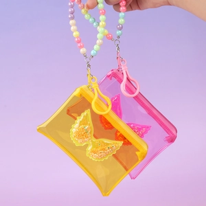 Handheld yellow and pink PVC butterfly coin purses with glittery wings and beaded chain