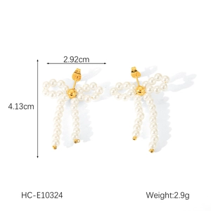 Detailed view of bow-shaped pearl earrings showing 2.92cm width and 4.13cm height