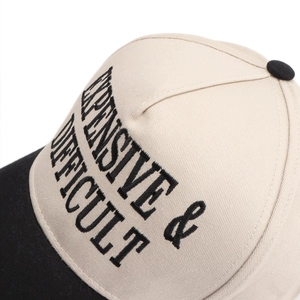 Macro detail of high-density cotton baseball cap with premium letter embroidery finish