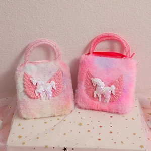 Detailed view of two pink plush unicorn handbags with sparkling sequins on a star box