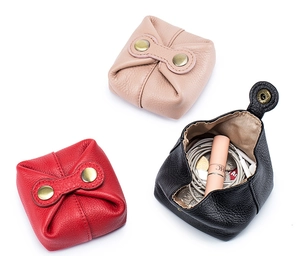 Genuine leather coin purses in pink, red, and black with brass snaps and lipstick storage
