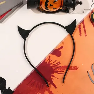 Halloween devil horn headband in black felt texture with festive party decorations