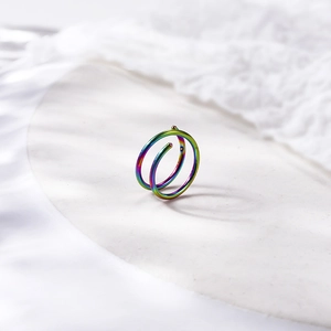 8mm double-layered rainbow stainless steel nose ring with ball ends on white cloth