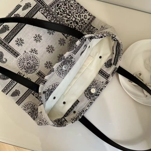 Top view of ethnic print tote bag showing large capacity and magnetic buckle closure