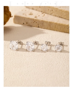 Macro detail of S925 sterling silver stud earrings with sparkling rose cut zircons