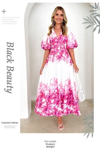 Close-up of white A-line dress featuring bright pink floral print and V-neckline detail