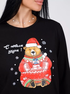Detail of Christmas bear print on black cotton long-sleeved pajamas top with festive Russian text