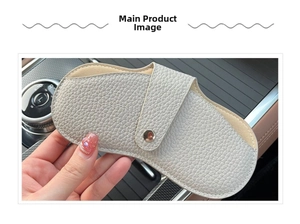 Close-up of gray pebble leather glasses case with metal snap closure and soft lining