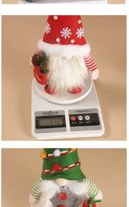 Detail showing the 172g weight of a handmade Christmas gnome doll on a digital scale