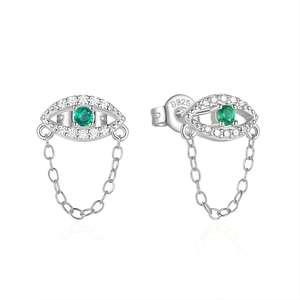 Detailed macro of S925 sterling silver evil eye stud earrings with green zircon and chains