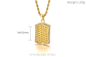 Detail of gold stainless steel dog tag pendant with woven texture and crystals