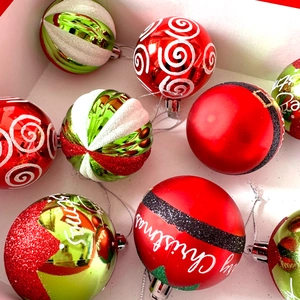 Macro detail of red green and white Christmas balls with glitter and plating finishes