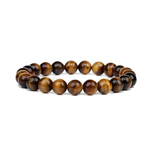 Macro detail of natural tiger eye stone beads showing polished texture and brown tones