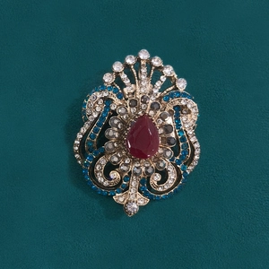 Vintage palace style brooch with red teardrop stone and colorful rhinestones on gold base