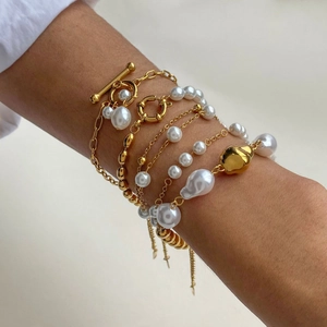 Elegant gold-tone stainless steel layered bracelet with baroque pearls and toggle clasp