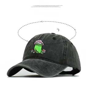 Close-up of mushroom frog embroidery on washed grey distressed cotton baseball cap