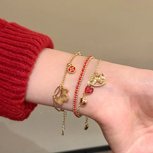 Three-piece gold plated bracelet set with horse charm and red woven rope for women