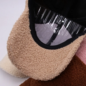Close-up of the plush lamb wool texture and inner lining of these stylish winter baseball caps