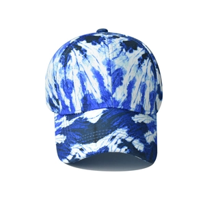 Front view of a blue and white tie-dye cotton baseball cap with a pre-curved brim and six-panel crown
