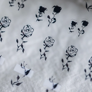Minimalist 5D black rose nail art stickers with hand-drawn floral patterns for manicures